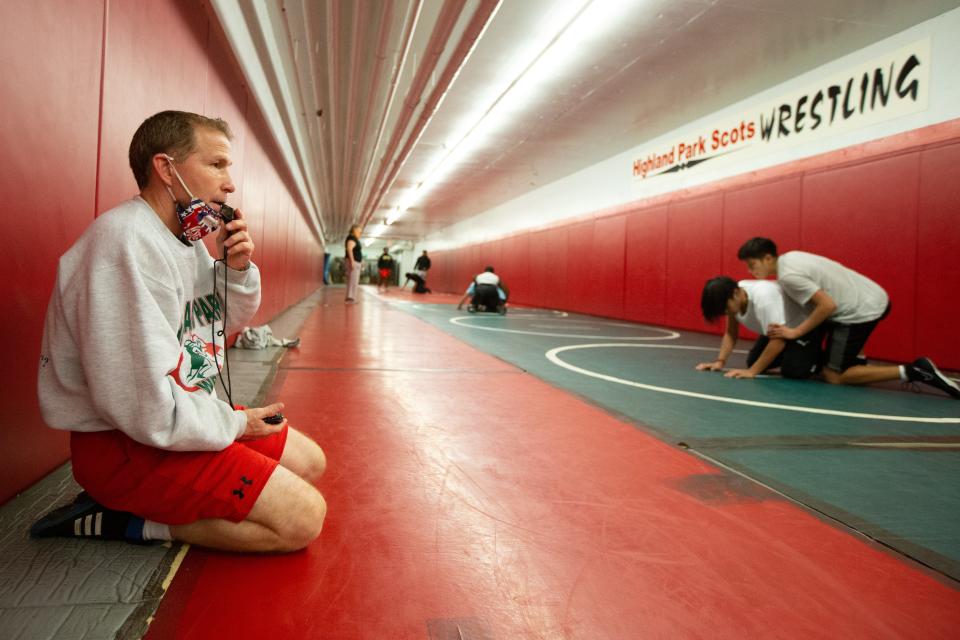 Highland Park coach Freddy Maisberger blows his whistle to get his students to begin working on the next take down during practice last week.