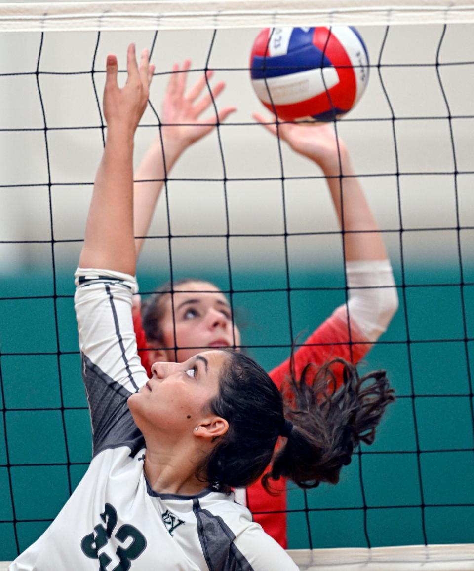 Vivian Castano of D-Y blocks a shot at Dylan Andrews of Barnstable in girls volleyball on Sept. 18, 2023.