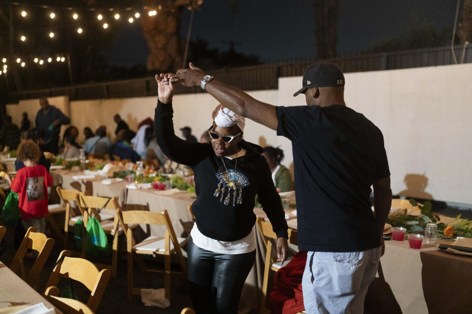 Andre Clements, left, and his wife, Vickki Willis, dance to music during a welcome dinner for the annual Families United 4 Justice Network Conference, hosted by the Black Lives Matter Global Network Foundation at its mansion in the Studio City neighborhood of Los Angeles, Thursday, Sept. 28, 2023. Willis said her son, Alteriq Pleasant, died in 2022, while in custody at Cook County Jail in Chicago. (AP Photo/Jae C. Hong)