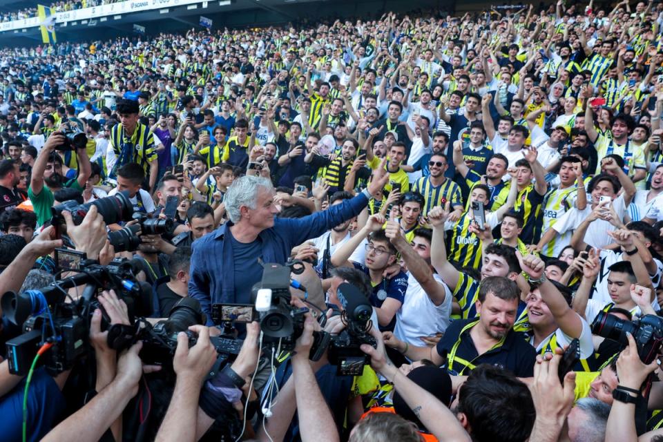 Jose Mourinho was unveiled in front of thousands of Fenerbahce fans on Sunday (AP)