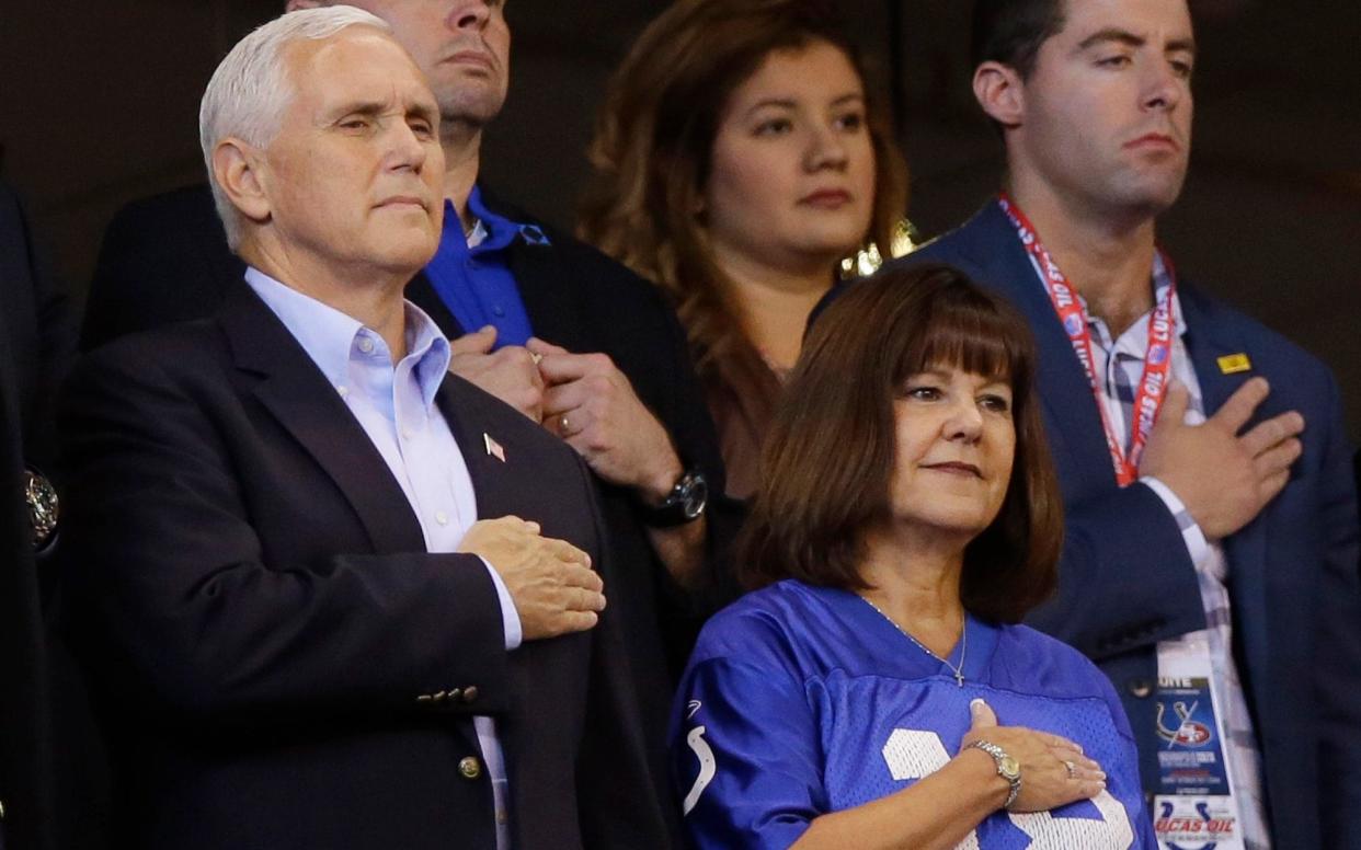 Mike Pence stands during the national anthem - AP