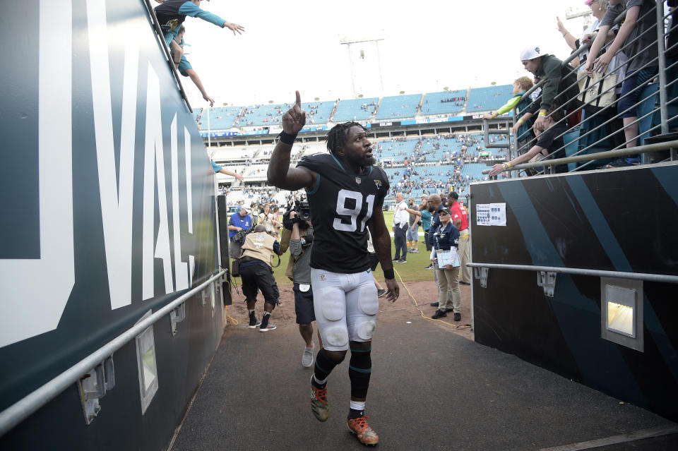 FILE - Then-Jacksonville Jaguars defensive end Yannick Ngakoue (91), now of the Indianapolis Colts, celebrates while leaving the field after an NFL football game against the Colts on Sunday, Dec. 2, 2018, in Jacksonville, Fla. A late-season collapse kept the Indianapolis Colts out of last year's playoffs. They don't plan to make the same mistake twice. (AP Photo/Phelan M. Ebenhack)