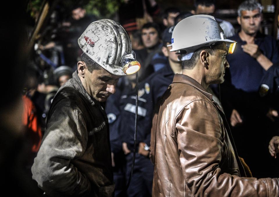 Miners wait at the gate of a mine after an explosion in Manisa on May 13, 2014.(BULENT KILIC/AFP/Getty Images)