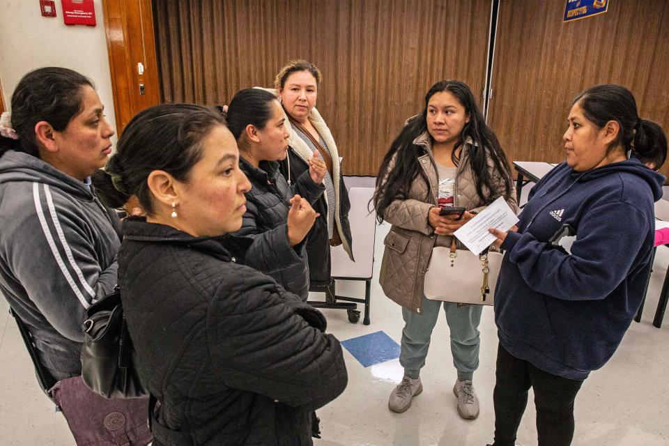 From left Magali Hern‡ndez, Gina Tercios, Hortensia Carbajal, Mar’a Garc’a, Claudia Hern‡ndez and Fermina Tapia gather after a parent meeting with Dr. Hugh Broomall, Deputy Superintendent at Red Clay Consolidated School District, at Marbrook Elementary School in Wilmington, Tuesday, Dec. 5, 2023. Red Clay is considering phasing out Spanish immersion instruction at the school.