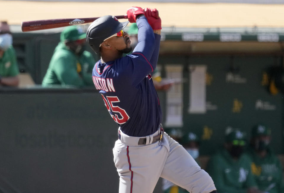 Minnesota Twins' Byron Buxton (25) hits a two run home run against the Oakland Athletics during the tenth inning of a baseball game on Wednesday, April 21, 2021, in Oakland, Calif. (AP Photo/Tony Avelar)