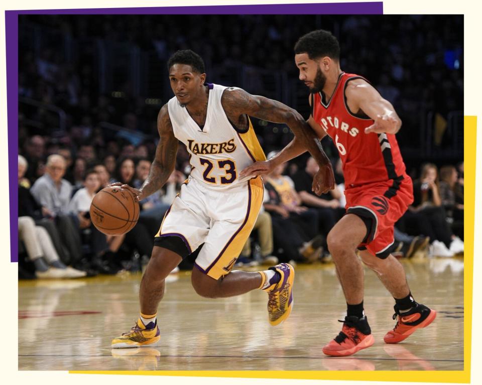 Photo of Lou Williams in a white Lakers jersey dribbling a ball while guarded by a player in a red Raptors jersey.