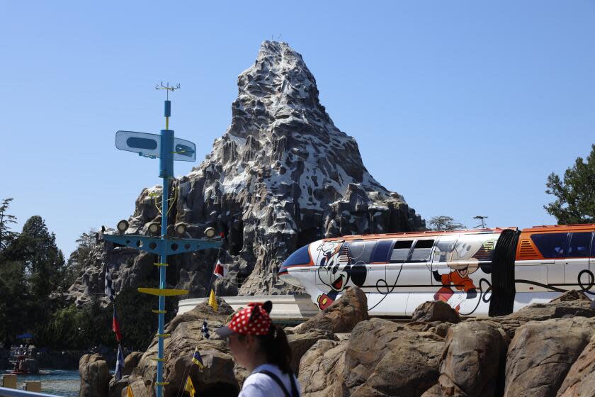 Anaheim, CA - March 11: Visitors ride the Disneyland Monorail past the Matterhorn Bobsleds at Disneyland in Anaheim Monday, March 11, 2024. (Allen J. Schaben / Los Angeles Times)