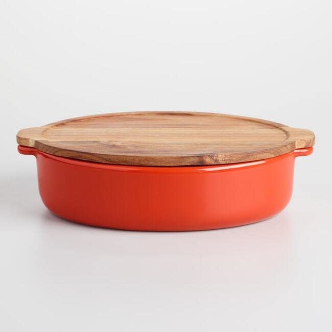 Add a splash of autumnal color to your table setting with this <a href="https://www.worldmarket.com/product/large+red+baker+with+oak+wood+trivet+lid.do?sortby=ourPicks&amp;from=Search" target="_blank">large red baker</a>.