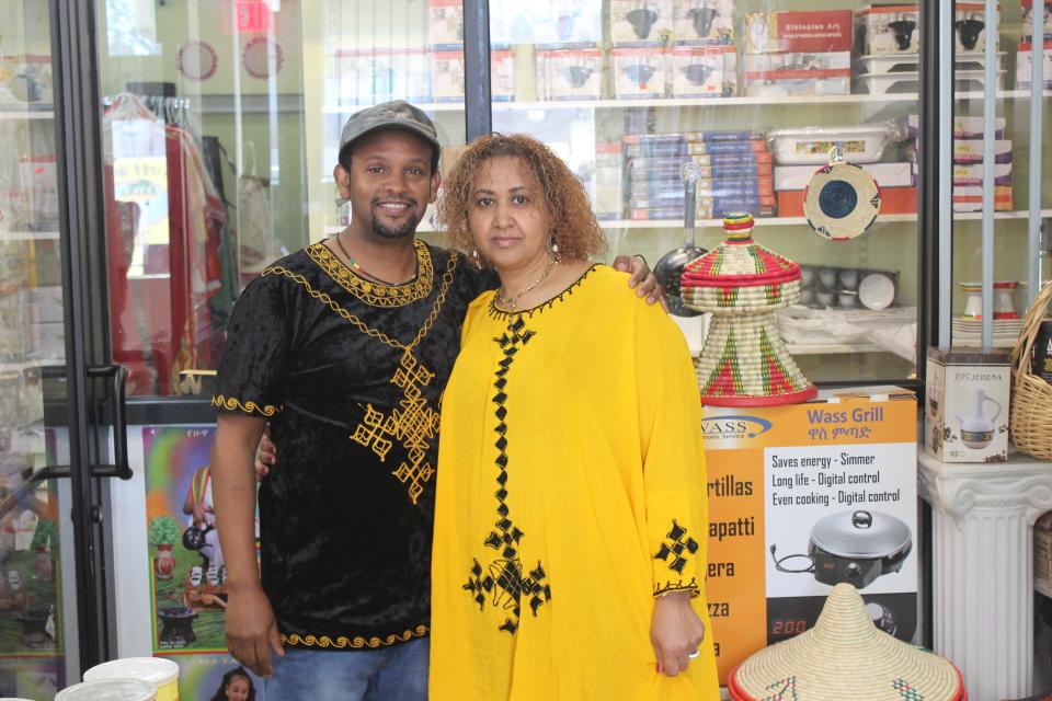 Simon Kebret and Frehiwot Mamo, the husband-and-wife duo behind Merkato Ethiopian Market & Grocery, stand inside their store.