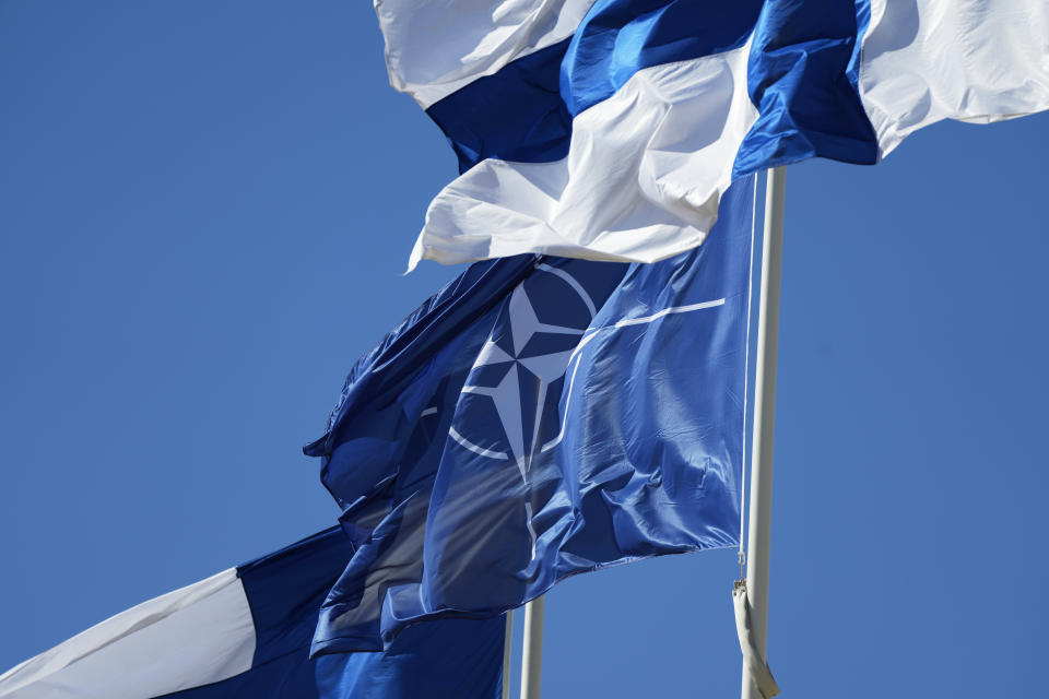 NATO and Finland flags flutter over the building of Ministry of Foreign Affairs in Helsinki, Finland, Tuesday, April 4, 2023. Finland prepared to make its historic entry into NATO Tuesday, a step that doubles the Western alliance’s border with Russia and ends decades of non-alignment for the Nordic nation. (AP Photo/Sergei Grits)