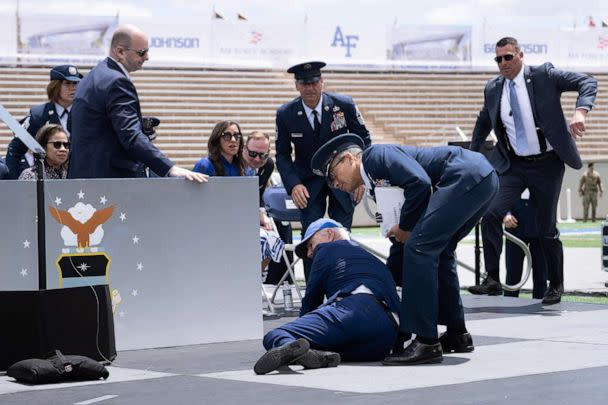 PHOTO: President Joe Biden is helped up after falling during the graduation ceremony at the United States Air Force Academy, just north of Colorado Springs, Colorado, June 1, 2023. (Brendan Smialowski/AFP via Getty Images)