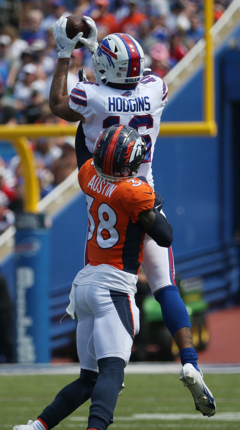 Bills receiver Isaiah Hodgins (16) makes a reception over Denvers Bless Austin during the Bills preseason game against Denver Saturday, Aug. 20, 2022 at Highmark Stadium.  Buffalo won the game 42-15.