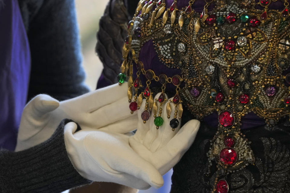 Detail on the bodice of Elizabeth Taylor's costume as Nadina Bullchoff in the film Young Toscanini, 1988 as it is displayed at Kerry Taylor Auctions in London, Tuesday, Feb. 27, 2024. The costume estimated at 3,000-5,000 UK Pounds (3,800-6,400 US Dollars) is one of 69 that will be for auction in the Lights Camera Auction event on March 5. The costumes have been donated by Cosprop in support of The Bright Foundation, an arts education charity, established and funded by John Bright, to provide life-enhancing, creative experiences for children and young people facing disadvantage. (AP Photo/Kirsty Wigglesworth)
