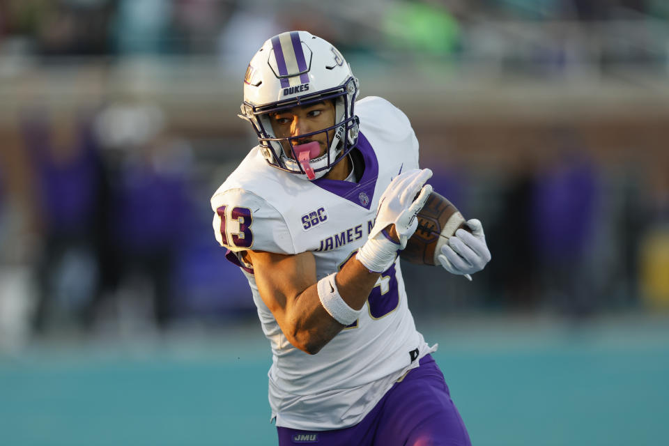 James Madison wide receiver Elijah Sarratt runs for a touchdown against Coastal Carolina during the first half of an NCAA college football game in Conway, N.C., Saturday, Nov. 25, 2023. (AP Photo/Nell Redmond)