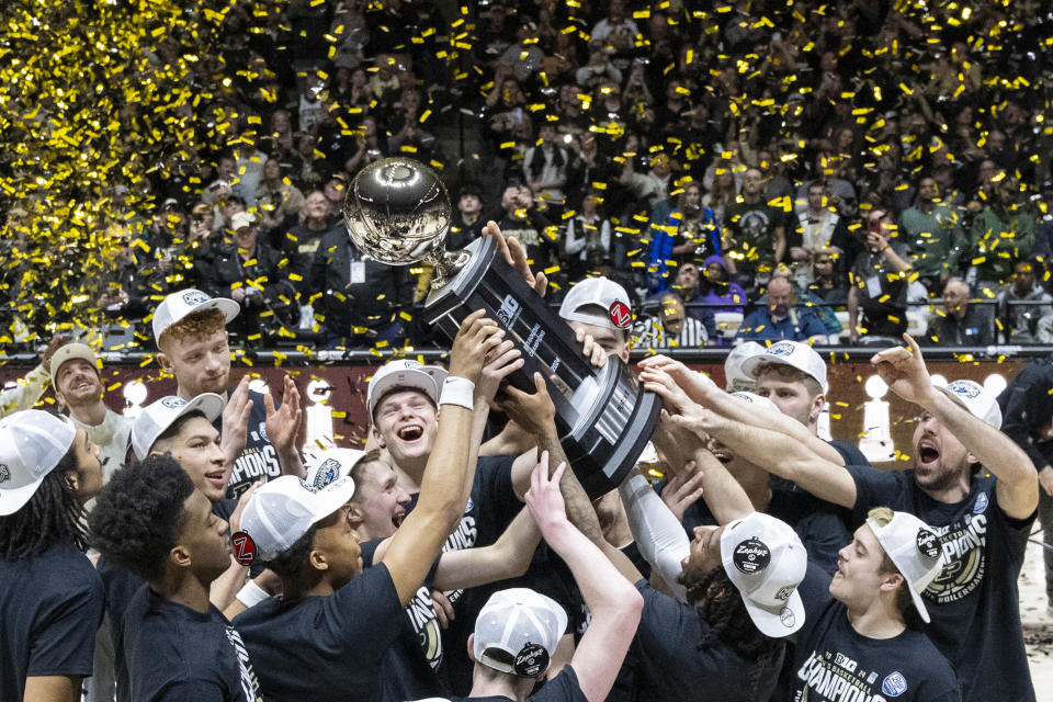 Purdue players celebrate after a win over Michigan State in an NCAA college basketball game, clinching at least a share of the Big Ten regular-season title, Saturday, March 2, 2024, in West Lafayette, Ind. (AP Photo/Doug McSchooler)