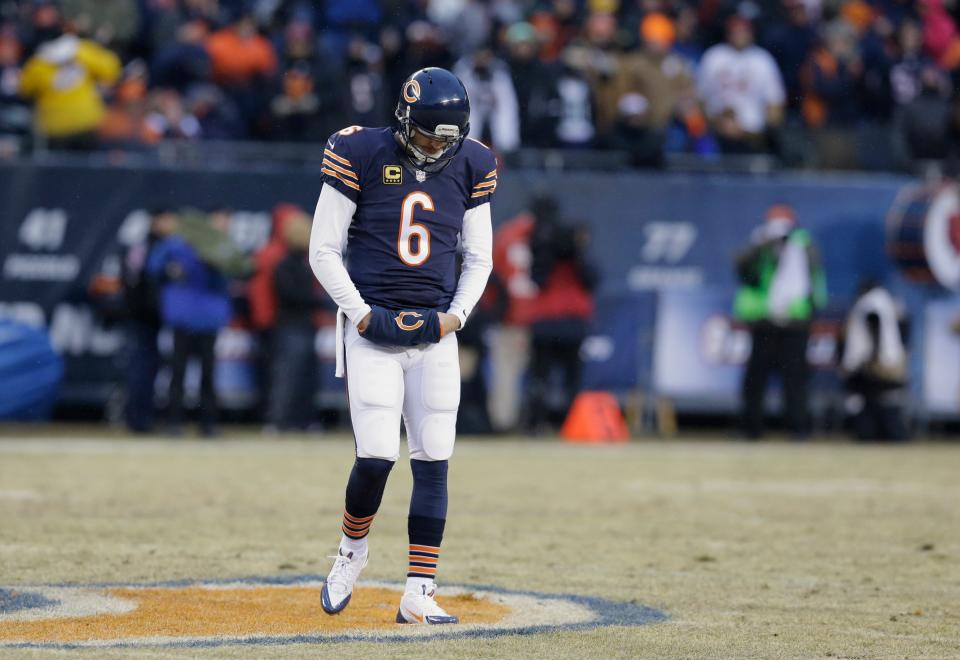 Chicago Bears quarterback Jay Cutler (6) looks down as he waits for the next play during the first half of an NFL football game against the Green Bay Packers, Sunday, Dec. 29, 2013, in Chicago.