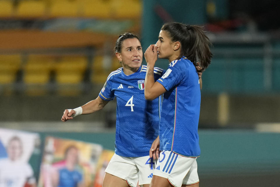 Italy's Lucia Di Guglielmo, left, embraces teammate Italy's Benedetta Orsi after she scored an own goal during the Women's World Cup Group G soccer match between South Africa and Italy in Wellington, New Zealand, Wednesday, Aug. 2, 2023. (AP Photo/Alessandra Tarantino)