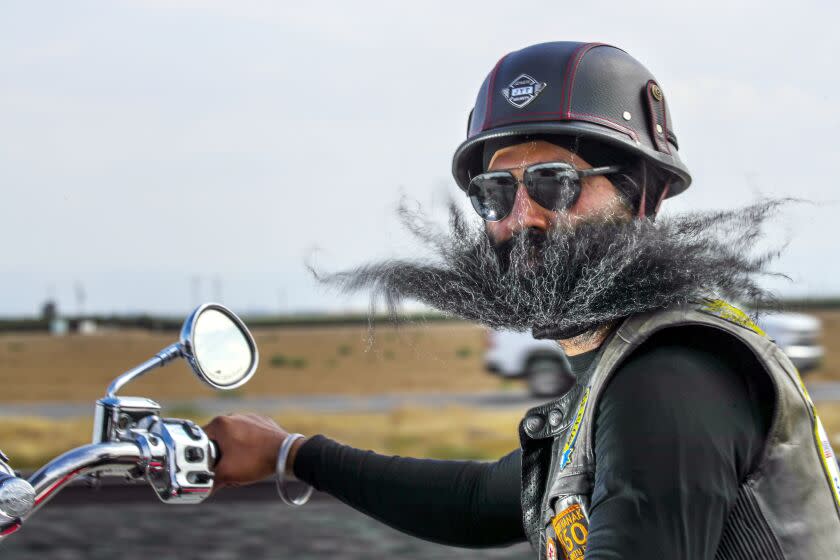 Bakersfield , CA - July 31: Satnam Singh, 42, secretary of Sikh Motorcycle Club USA on cross-country Ride Against Hate ride to commemorate the 10th. anniversary of mass shooting at Sikh Temple in Oak Creek, Wisconsin, riding through Highway 99 on Sunday, July 31, 2022 in Bakersfield , CA. (Irfan Khan / Los Angeles Times)