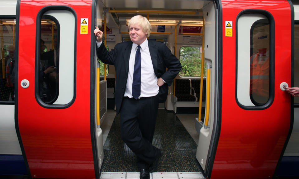 London Mayor Boris Johnson stands in the door of the first new air-conditioned train in London as part of a scheme to have 40\% of tube trains air-conditioned by 2015. PRESS ASSOCIATION Photo. Picture date: Monday August 02, 2010. The train serving the Metropolitan Line is the first of 191 brand new walk-through trains. See PA story TRANSPORT Air. Photo credit should read: Katie Collins/PA Wire