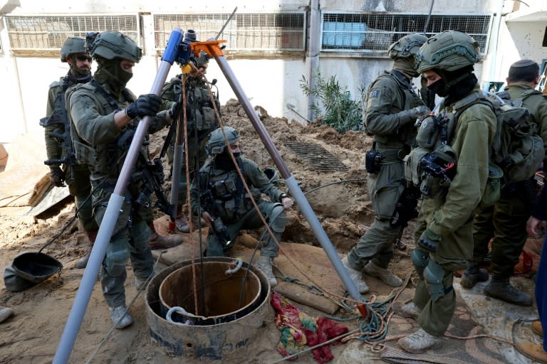 This picture taken during a media tour organised by the Israeli army on February 8 shows Israeli soldiers checking a shaft inside the evacuated Gaza City headquarters compound of the United Nations agency for Palestinian refugees (UNRWA) (JACK GUEZ)