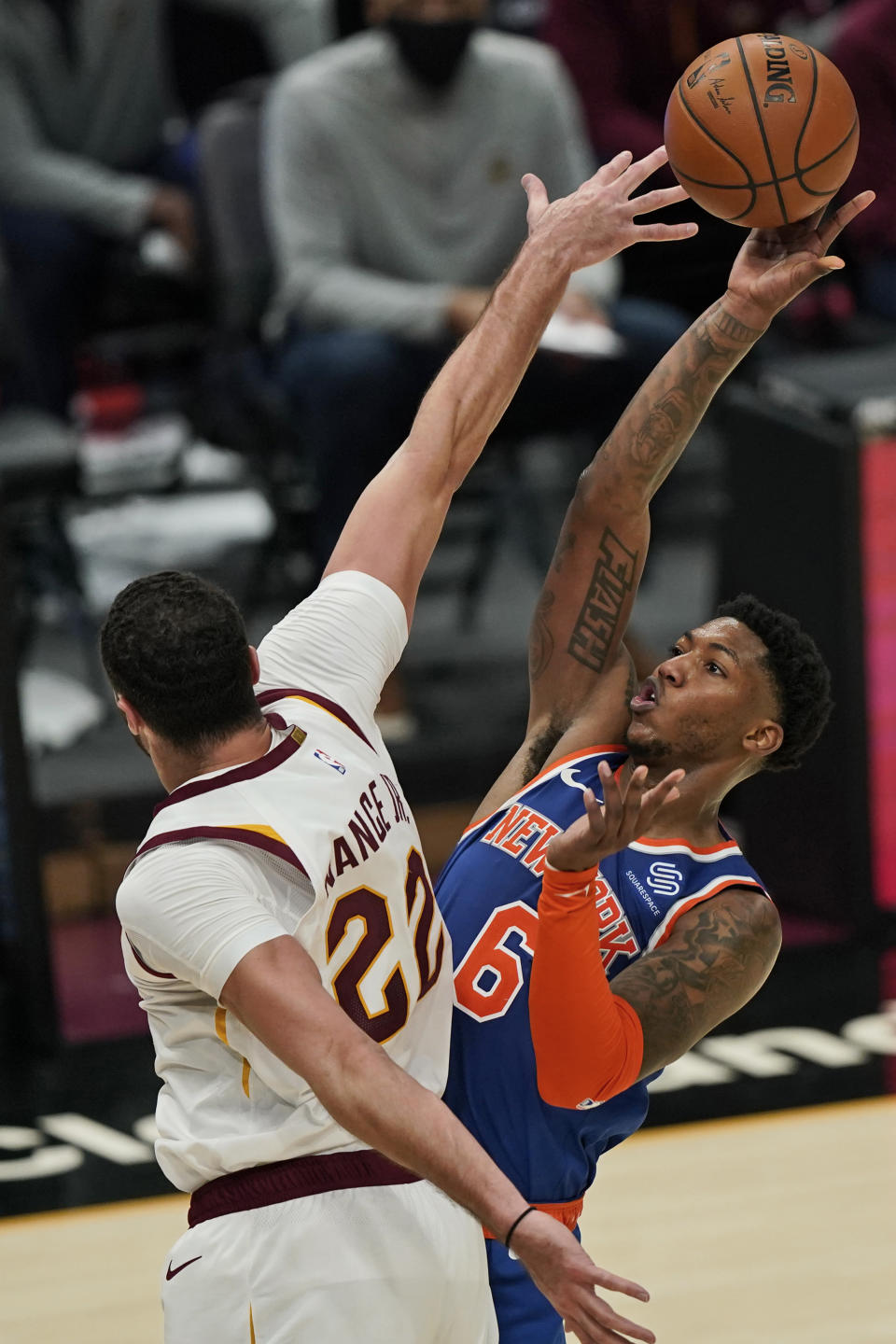 New York Knicks' Elfrid Payton (6) shoots over Cleveland Cavaliers' Larry Nance Jr. (22) during the second half of an NBA basketball game Tuesday, Dec. 29, 2020, in Cleveland. The Knicks won 95-86. (AP Photo/Tony Dejak)