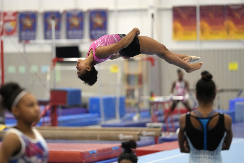 FILE - In this May 11, 2021, file photo, gymnast Jordan Chiles practices her floor routine in Spring, Texas. Three years ago, Jordan Chiles wasn't sure she wanted to be a gymnast anymore. A move to Texas, a dash of maturity and a renewed confidence in herself have the 20-year-old on the cusp of earning a spot on the U.S. Olympic team. (AP Photo/David J. Phillip, FIle)