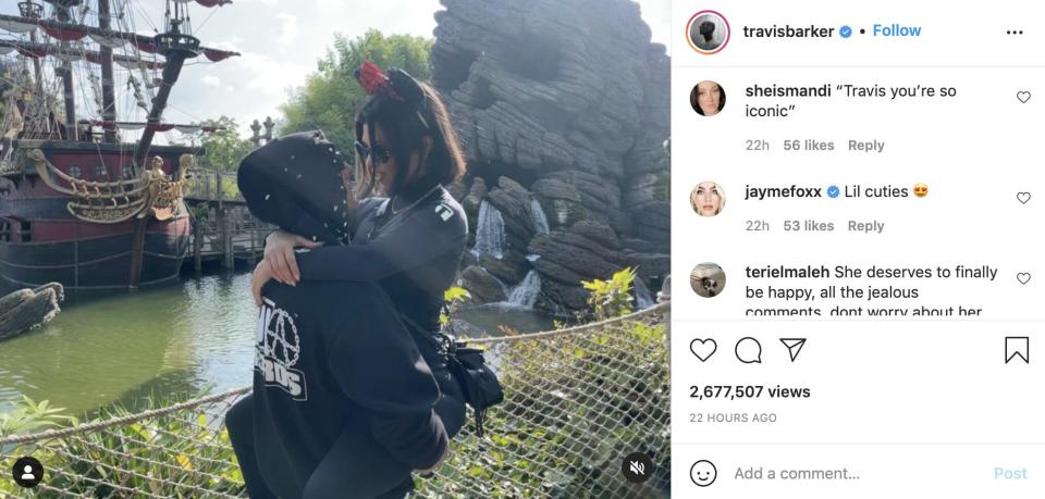 Travis Barker and Kourtney Kardashian at Disneyland.