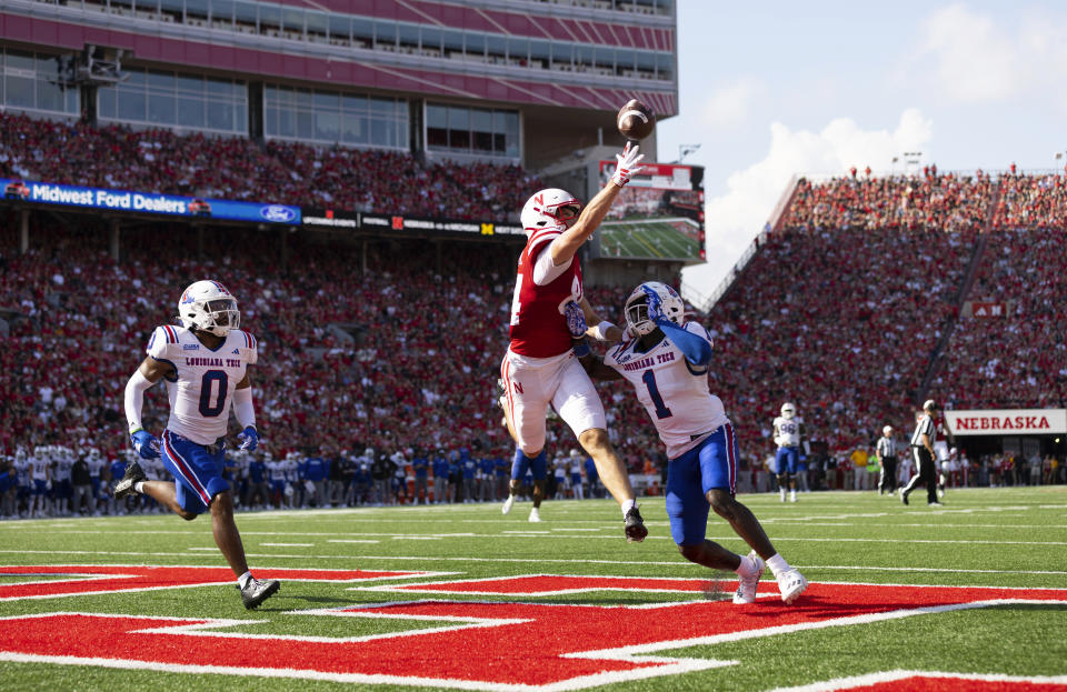 Nebraska's Alex Bullock (84) reaches for and misses a pass in the end zone against Louisiana Tech's Myles Heard (0) and Willie Roberts (1) plays against Nebraska during the first half of an NCAA college football game, Saturday, Sept. 23, 2023, in Lincoln, Neb. (AP Photo/Rebecca S. Gratz)