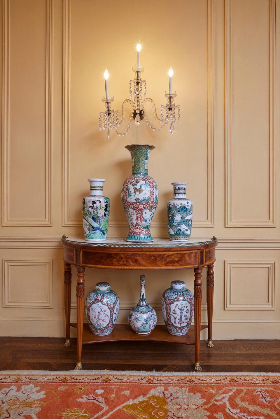 A pair of large Chinese iron red ground and famille verte phoenix and qilin vases, top middle, are part of the Wolf Family Collection.