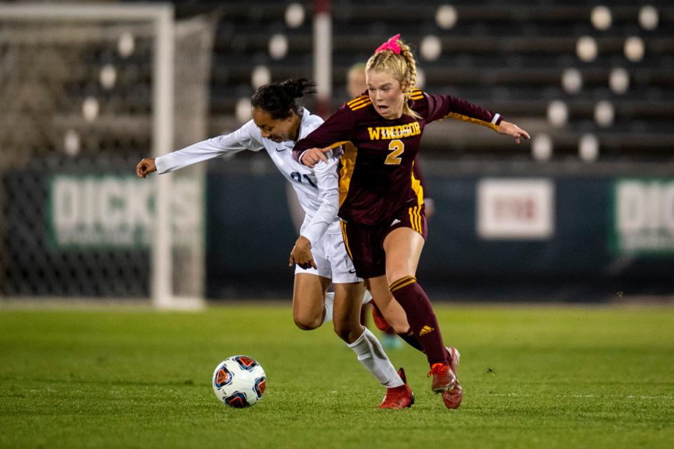 Windsor's Ella Moody (2) competes for the ball against Northfield High School's Lesley Vasquez (21) during the 4A girls state soccer championship game at Dick's Sporting Goods Park in Commerce City on May 24.