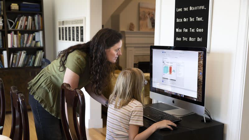 Karyn Tripp and her daughter, Millie, 9, work on Millie’s math with the CTCMath curriculum at their home in Cedar Hills on Wednesday, Aug. 30, 2023.