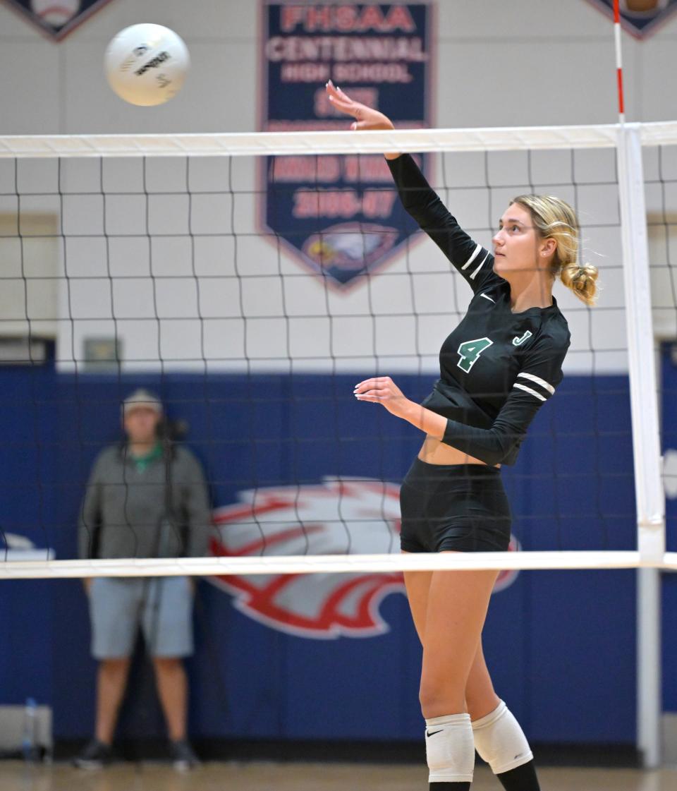 Jupiter volleyball's Sarah Brodner hits the ball during a district final against Fort Pierce Central on Oct. 18, 2023.