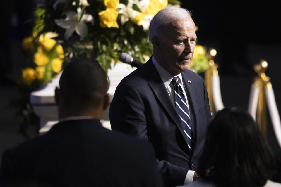 President Joe Biden walks by U.S. Rep. Eddie Bernice Johnson's casket after paying his respects during her wake at Concord Church in Dallas on Monday, Jan. 8, 2024. Johnson, a trailblazing North Texas Democrat who served 15 terms in Congress, died on Dec. 31. (Juan Figueroa/The Dallas Morning News via AP, Pool)