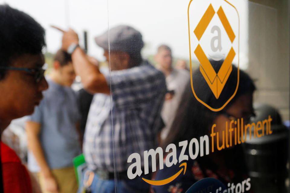 Job seekers line up to apply during "Amazon Jobs Day," a job fair being held at 10 fulfillment centers across the United States aimed at filling more than 50,000 jobs, at the Amazon.com Fulfillment Center in Fall River, Massachusetts, U.S., August 2, 2017.   REUTERS/Brian Snyder