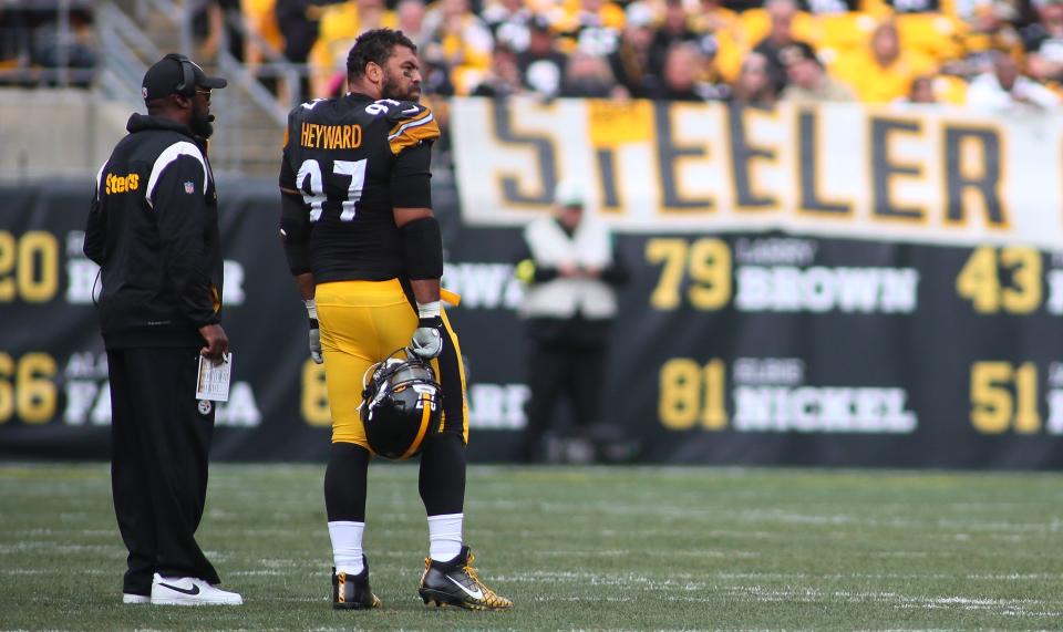 Head Coach Mike Tomlin of the Pittsburgh Steelers talks to Cameron Heyward (97) during a timeout in the game against the New York Jets at Acrisure Stadium in Pittsburgh, PA on October 2, 2022. 