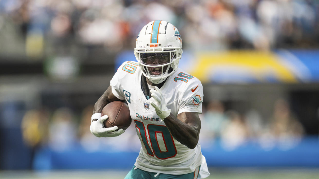 Miami Dolphins wide receiver Tyreek Hill (10) runs with the ball during an NFL football game against the Los Angeles Chargers, Sunday, Sept. 10, 2023, in Inglewood, Calif. (AP Photo/Kyusung Gong)