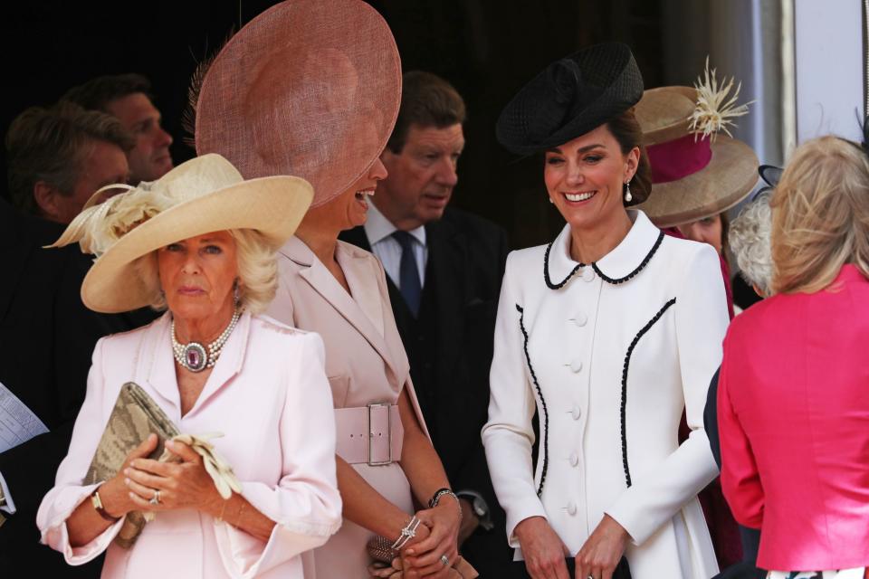 The Duchess of Cambridge joined senior members of the royal family and foreign monarchs to watch the traditional annual Garter Day procession in Windsor today.Two Queens accompanied Kate and Britain's royal ladies to watch their husbands on parade at the annual event, which celebrates the most senior order of the chivalry in the UK.Queen Maxima of the Netherlands and Queen Letizia of Spain stood at the Galilee Porch outside St George’s Chapel in Windsor Castle with the Duchess of Cornwall, the Duchess of Cambridge and the Countess of Wessex to see the procession of the Knights of the Garter. The Dutch King Willem-Alexander and his Spanish counterpart King Felipe were installed as companions of the ancient Order of the Garter in the chapel after an earlier investiture up the hill in the state apartments.Founded by Edward III in 1348, the Most Noble Order of the Garter is the most senior order of knighthood in the British honours system, outranked in precedence only by the Victoria Cross and the George Cross.For the occasion, the duchess cut a chic figure in a perfectly tailored white coat dress with black trim by Catherine Walker, a British label often favoured by the duchess, which was also a go-to designer for her late mother-in-law, Princess Diana.Argentine-born Maxima, 48, and Letizia, 46, stood chatting with Kate, the Duchess of Cornwall and the Countess of Wessex outside the chapel before the procession began.Wearing the lavish velvet robes, glistening insignia and plumed hats of the Order of the Garter, the Queen and the royal knights processed through the grounds of Windsor Castle.Camilla, 71, wore a pale pink Anna Valentine coat dress with a Philip Treacy hat, while Sophie, 54, sported a Suzannah dress and Jane Taylor hat.They stood smiling with Kate, Maxima in particular beaming, as their husbands walked by in the procession.Further down the hill, Felipe, 51, waved merrily at Spanish journalists as the procession neared the chapel.The Queen, accompanied by Princess Alexandra, travelled by car to the chapel, a few hundred yards down the hill from her apartments, behind the knights’ procession.Hundreds of spectators watched the Garter Knights walking through the grounds of the castle in the summer sunshine, wearing their blue velvet robes and black velvet hats with white plumes made from ostrich feathers.The Queen was joined by Prince Charles, the Duke of Cambridge and other senior royals in St George's Chapel for the service.Former Prime Minister Sir John Major, Lord Phillips of Worth Matravers, a past president of the Supreme Court, and Admiral Lord Boyce, a former head of the UK's armed forces are also Garter knights and were part of the procession in front of the royals.King Felipe VI and Willem-Alexander of the Netherlands were installed in the chapel as supernumerary, or stranger, Knights of the Garter.Felipe was appointed by the Queen during his July 2017 state visit while Willem-Alexander received the honour during his state visit in October 2018.Earlier in the day there was a private Investiture in the Garter throne room at Windsor Castle, where a new Lady Companion, former Olympic athlete Lady Mary Peters, and a Knight Companion, Robert Gascoyne-Cecil, the Marquess of Salisbury, were invested with the Order's insignia by the Queen.Recipients of the honour are chosen because they have held public office, contributed to national life or served the sovereign personally.The appointment of Knights of the Garter is in the Queen's gift and is made without consulting ministers.The Queen is sovereign of the order and a number of other British and foreign royals are additional knights of the order, including Philip, Charles and William.The foreign monarchs were invested with the insignia of the Order by the Queen in the castle's garter throne room and during the service were installed, or formally seated, in the chapel's quire.