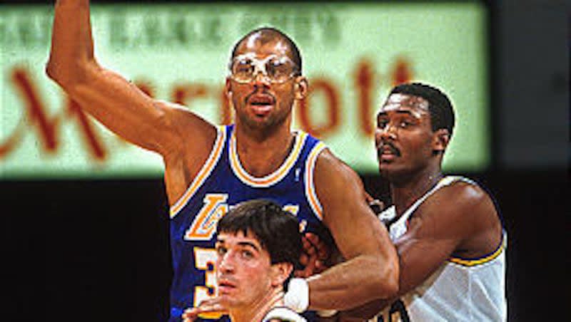 Karl Malone and John Stockton of the Utah Jazz guard L.A. Laker Kareem Abdul-Jabbar in a game in Salt Lake in the late 1980s. On April 5, 1984, Abdul-Jabbar passed Wilt Chamberlain to become first on the NBA's all-time scoring list.