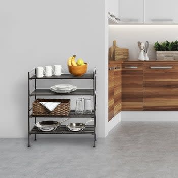 Four-tier shoe rack placed in kitchen with various dish ware