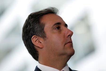 FILE PHOTO - Michael Cohen, President Donald Trump's personal attorney, looks on as his attorney (not pictured) delivers a statement to reporters after meeting with Senate Intelligence Committee staff on Capitol Hill in Washington, U.S., September 19, 2017. REUTERS/Aaron P. Bernstein