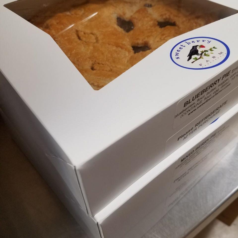 A stack of boxed pies from Sweet Berry Farm.