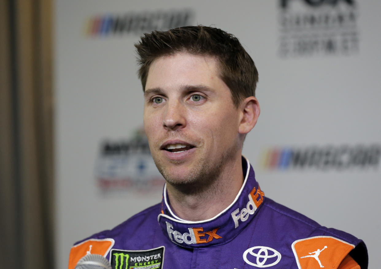 Denny Hamlin speaks during media day for the NASCAR Daytona 500 auto race at Daytona International Speedway, Wednesday, Feb. 14, 2018, in Daytona Beach, Fla. (AP Photo/Terry Renna)