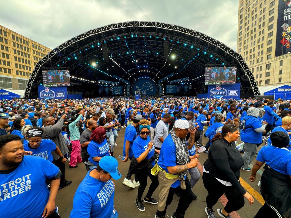 More than 100 people do the hustle in front of the NFL draft's main theater at the 2024 NFL draft in Detroit on Saturday, April 27, 2024.