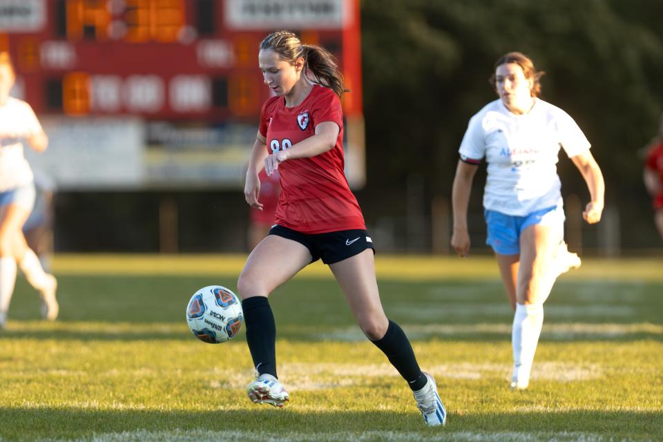 Field's Adriana Bright runs with the ball during a soccer match against the Alliance Aviators in Brimfield, OH.