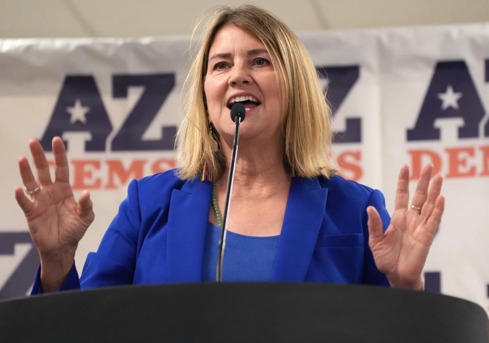 Lauren Kuby, who is running for a seat on the Corporation Commission, speaks at an Arizona Democratic Party Unity Rally with statewide candidates to energize Democratic voters and volunteers ahead of the November election at Carpenters Union Hall on Saturday, Aug. 27, 2022.  