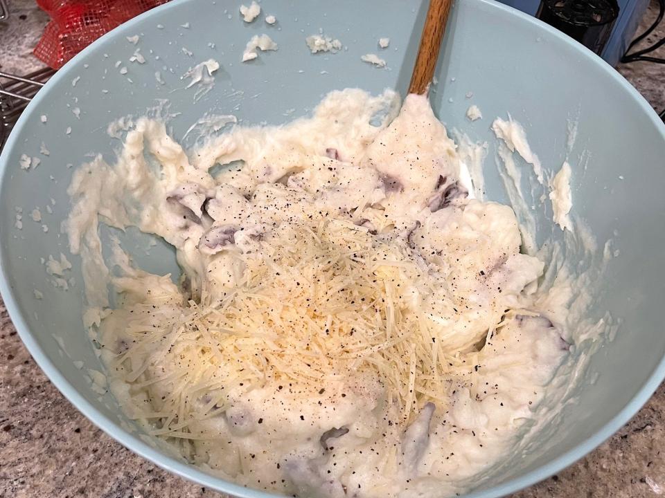 Adding seasoning to Ina Garten's smashed potatoes