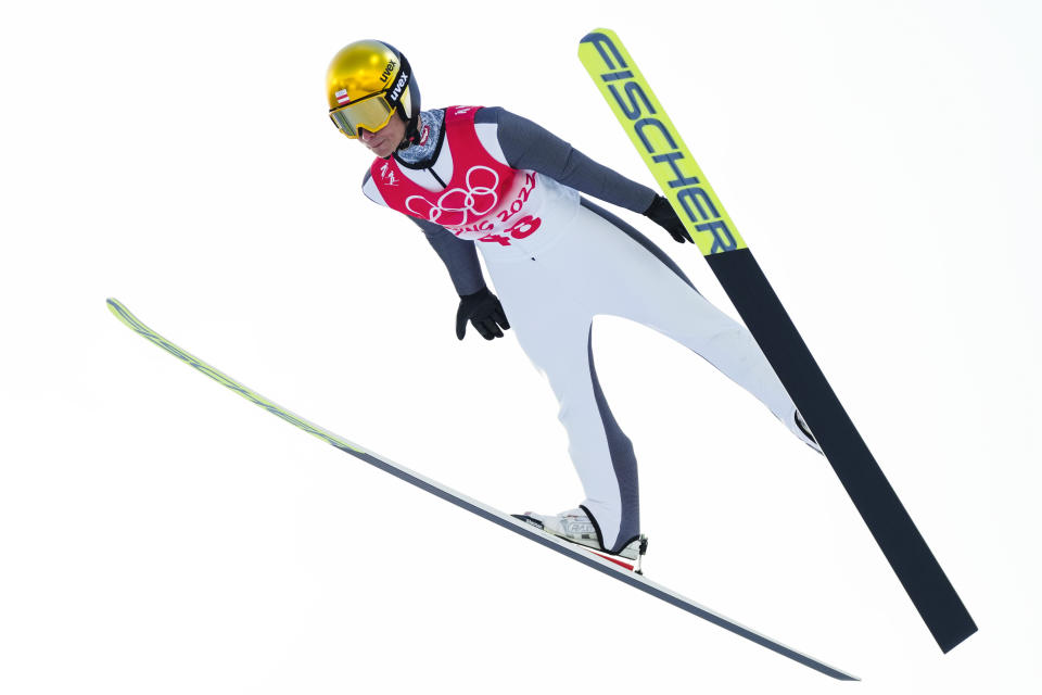 Johannes Lamparter, of Austria, soars through the air during the trial round of the individual Gundersen large hill/10km ski jumping competition at the 2022 Winter Olympics, Tuesday, Feb. 15, 2022, in Zhangjiakou, China. (AP Photo/Andrew Medichini)