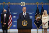 President Joe Biden, center, speaks as he announces that he is nominating Jerome Powell, left, for a second four-year term as Federal Reserve chair and Lael Brainard, right, as vice chair, the No. 2 slot at the Federal Reserve, during an event in the South Court Auditorium on the White House complex in Washington, Monday, Nov. 22, 2021. (AP Photo/Susan Walsh)