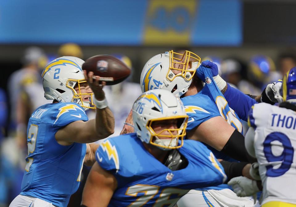 Chargers quarterback Easton Stick, left, passes the ball during the first half Saturday.