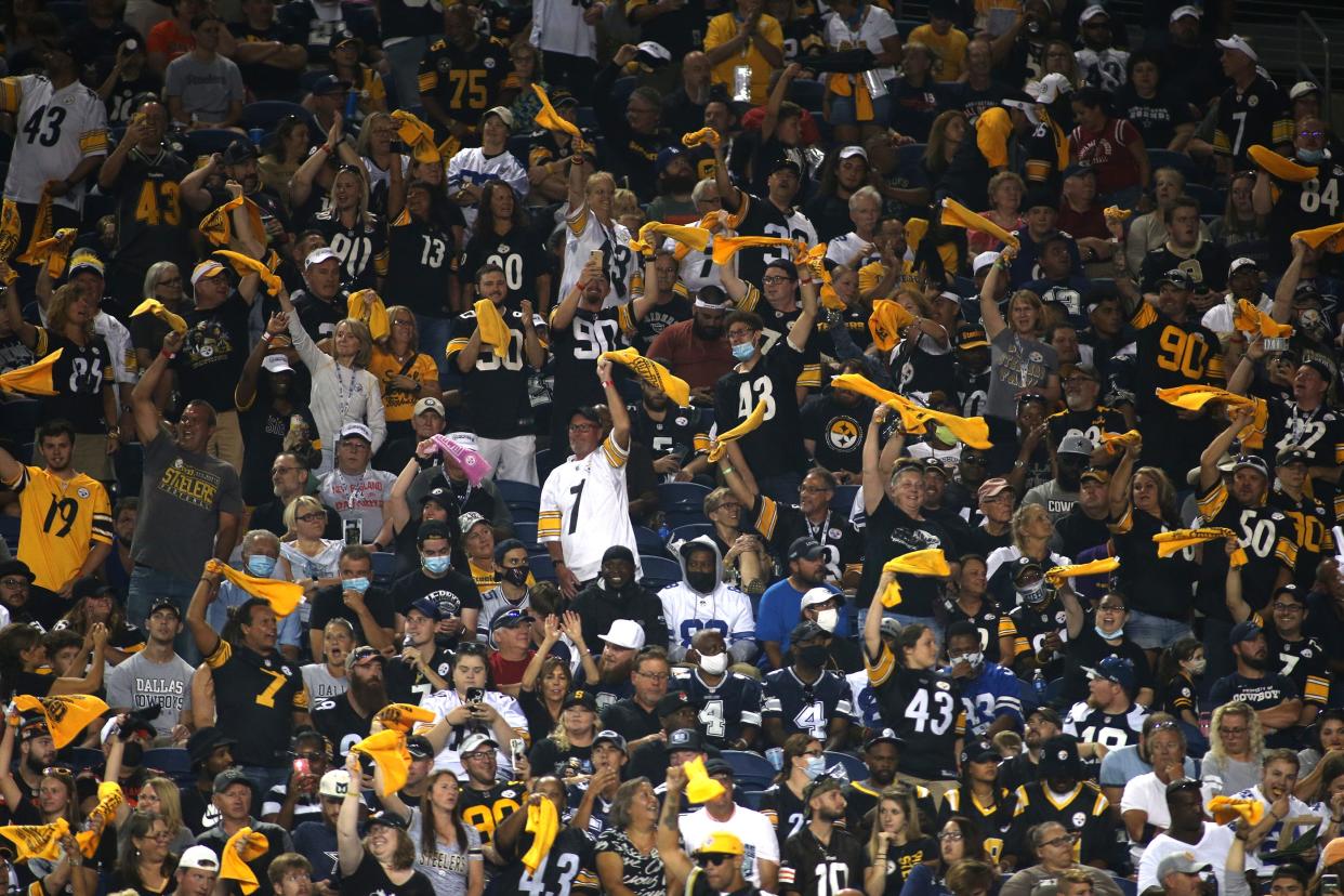 Pittsburgh Steelers fans wave the Terrible Towel after the Steelers gain a first down during the second half of the 2021 Hall Of Fame Game against the Dallas Cowboys on Thursday, August 5, 2021 at Tom Benson Hall Of Fame Stadium in Canton, Ohio.